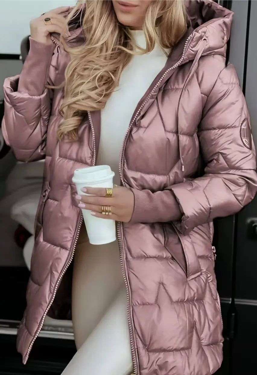a rose gold glossy hooded down puffer jacket with a quilted design and a hood