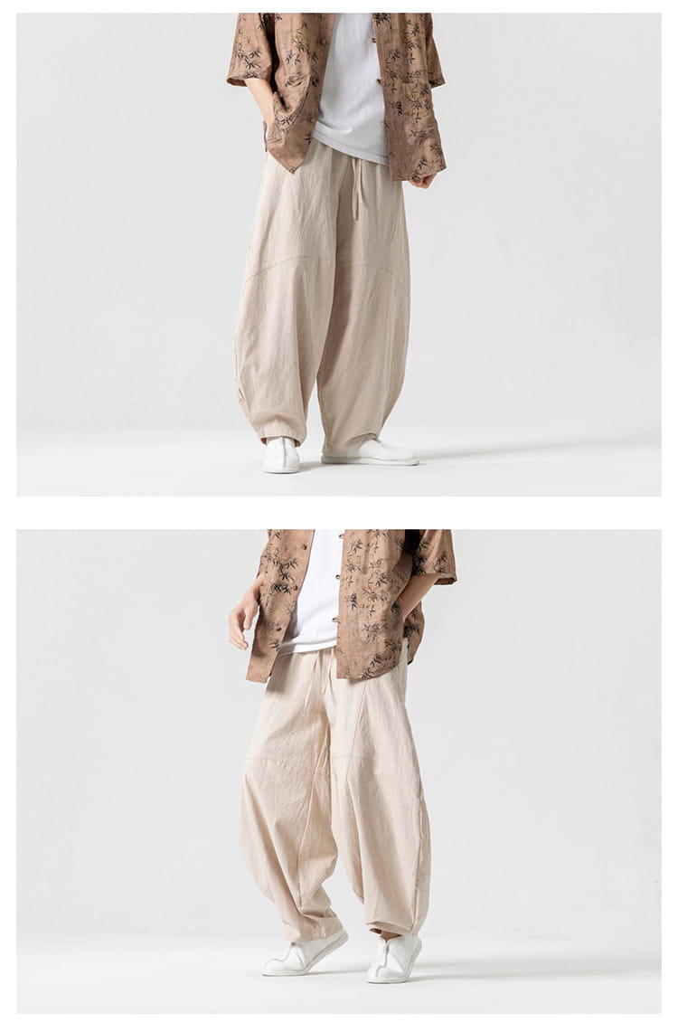 Pantalon ample beige en lin de tai-chi, coupe ample et décontractée, avec taille à cordon et plis discrets, conçu pour un port décontracté.