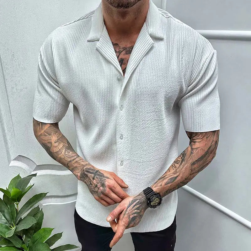 White ribbed knit short sleeve button up shirt featuring a textured fabric for men.