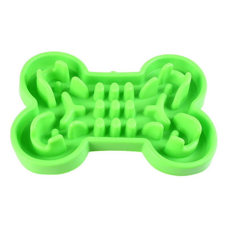 bol pour chien à alimentation lente vert vif en forme d’os, conçu comme un puzzle pour une alimentation lente.