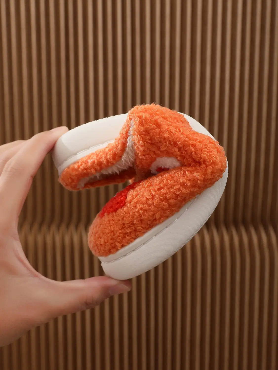 Orange and white plush floral cotton slippers with a soft TPR sole and fuzzy slip-on texture