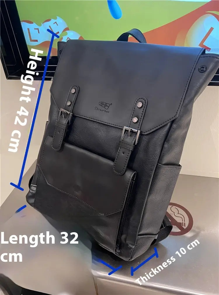 Black leather vintage leather college backpack with large capacity travel bag featuring silver-toned metal buckles and a subtle brand logo on the front flap.