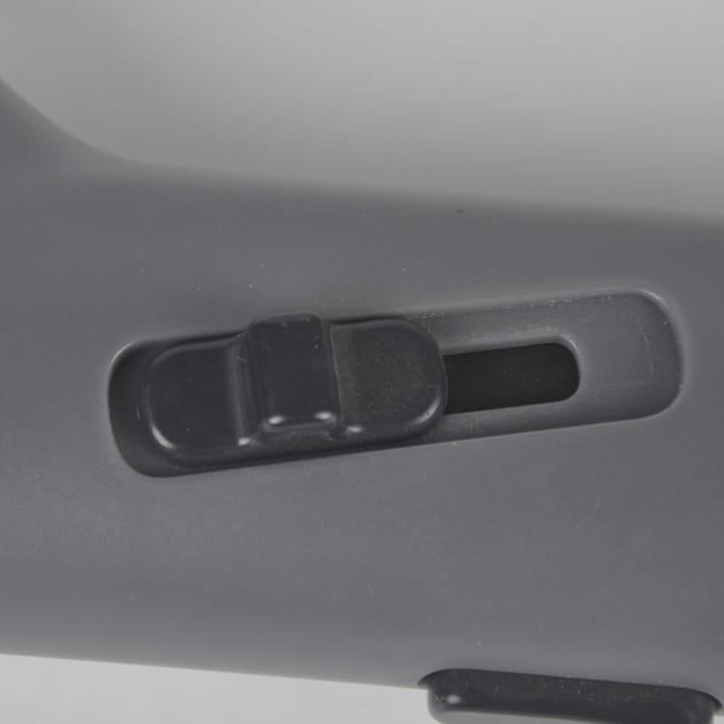 gray plastic sliding switch with black slider on a gray housing for the dog training snack launcher pet treat shooter