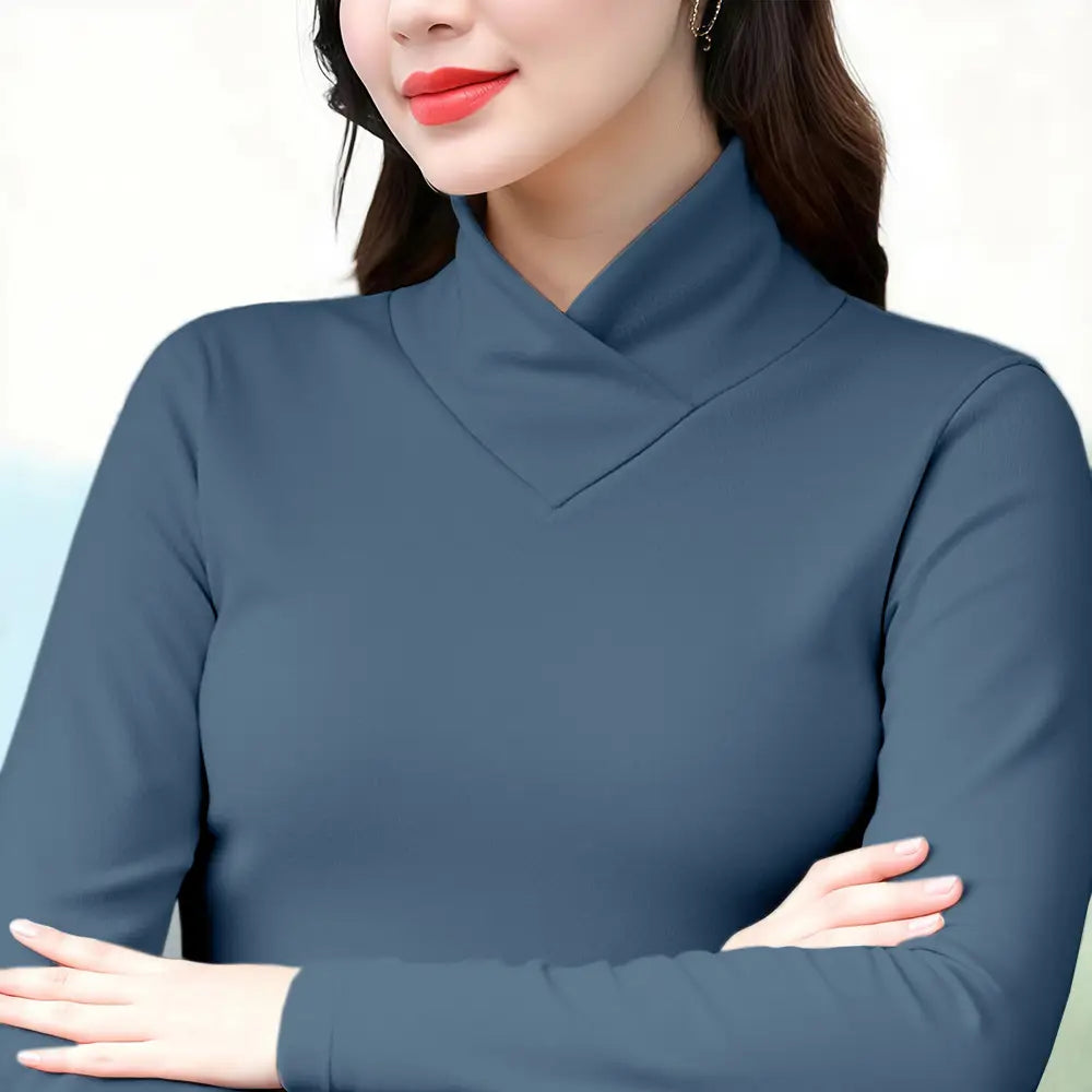 A sleek dark teal long-sleeved Dralon turtleneck thermal base layer top with a high folded collar.