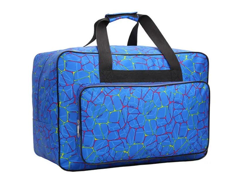 Multifunctional cracked pattern nylon travel duffel bag in blue with a vibrant red and yellow cracked design and black handles and trim.