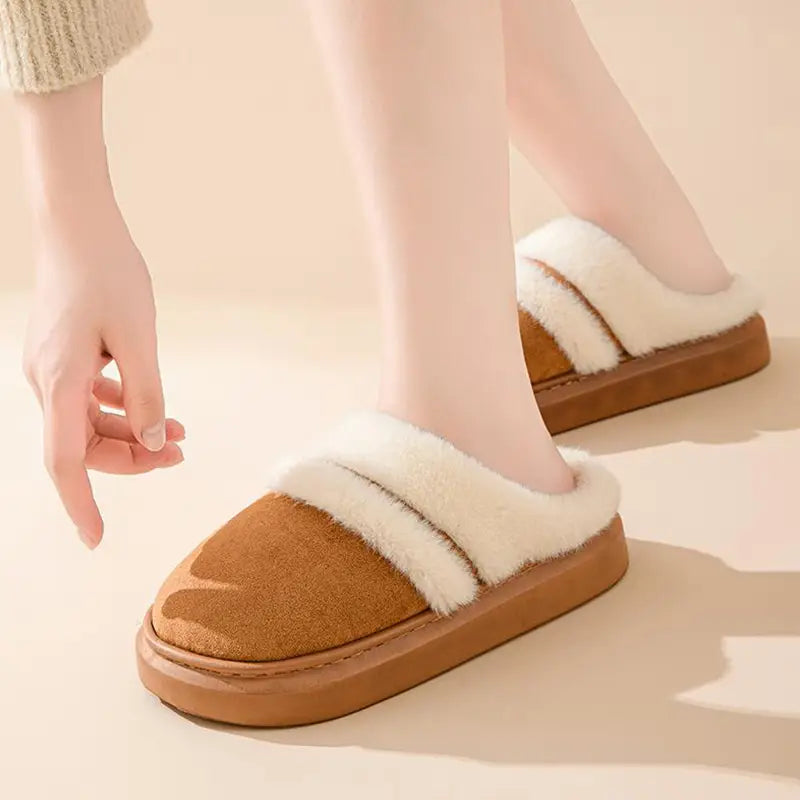 women’s brown suede slip-on mules with plush white faux fur lining and a soft cushioned thick sole designed as winter house slippers