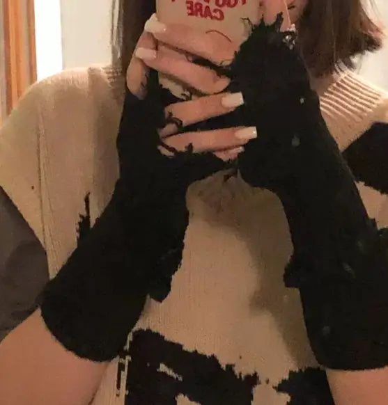 Black tattered knit fingerless gloves unisex with black color, frayed distressed edges, and delicate lace detailing