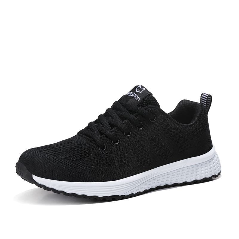 Black mesh fly woven sneaker with breathable athletic design black laces and white rubber sole.