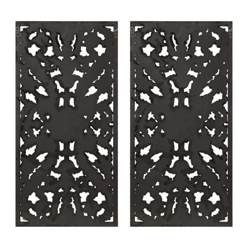 Black metal decorative panels featuring intricate symmetrical cut-out patterns from the carved wood wall decor set distressed botanical panels.