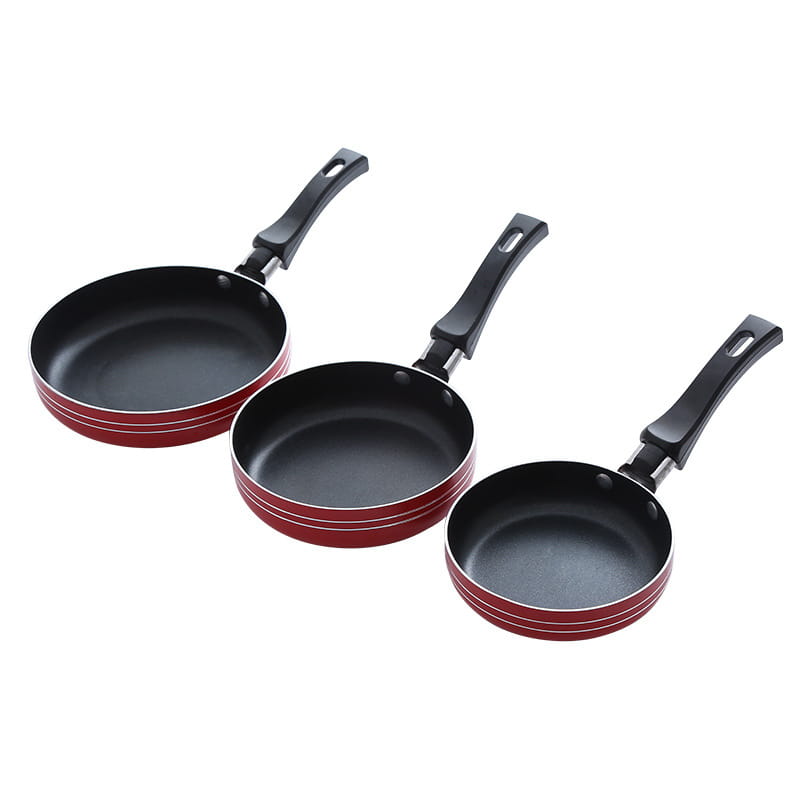 Set of three red and black mini non-stick frying pans with ergonomic handles made of aluminum cookware.