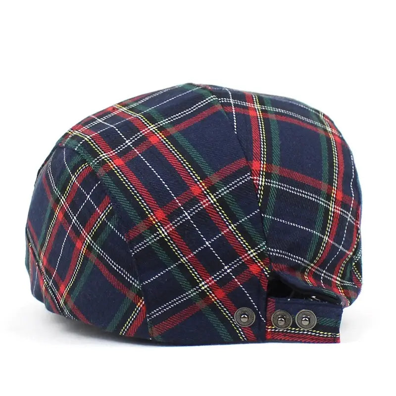 A navy blue flat cap plaid painter hat featuring red green and white intersecting stripes.