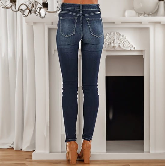 Women’s high-waisted stretch skinny jeans in dark blue with a classic five-pocket design and subtle fading at the thighs.