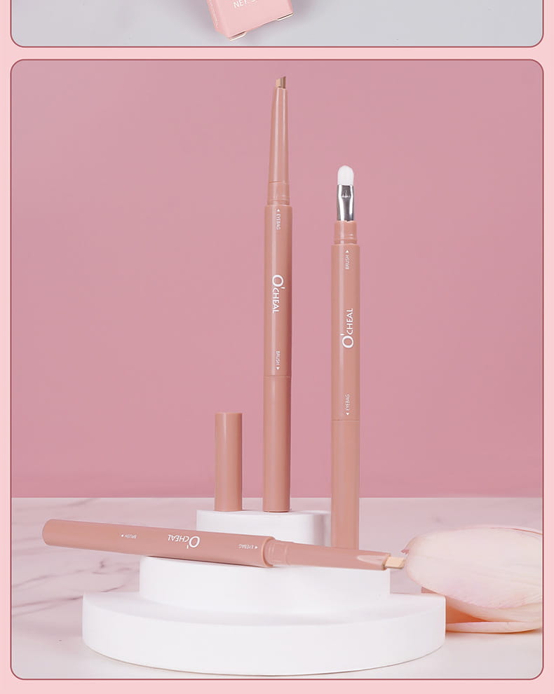 Beige ochal eyeliner pencil with a fine tip and silver ferrule displayed with its cap on white tiered stands part of rose gold dual ended eyeshadow and silkworm pen set.