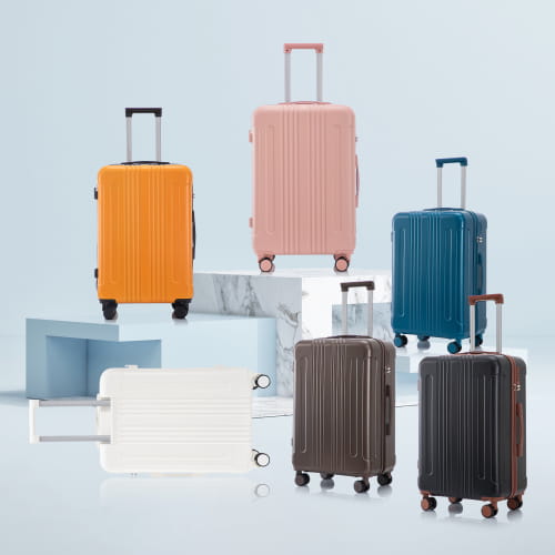a set of six hard-shell abs spinner suitcases with tsa lock in vibrant orange soft pink deep blue white dark brown and black featuring vertical ridged patterns and matching spinner wheels