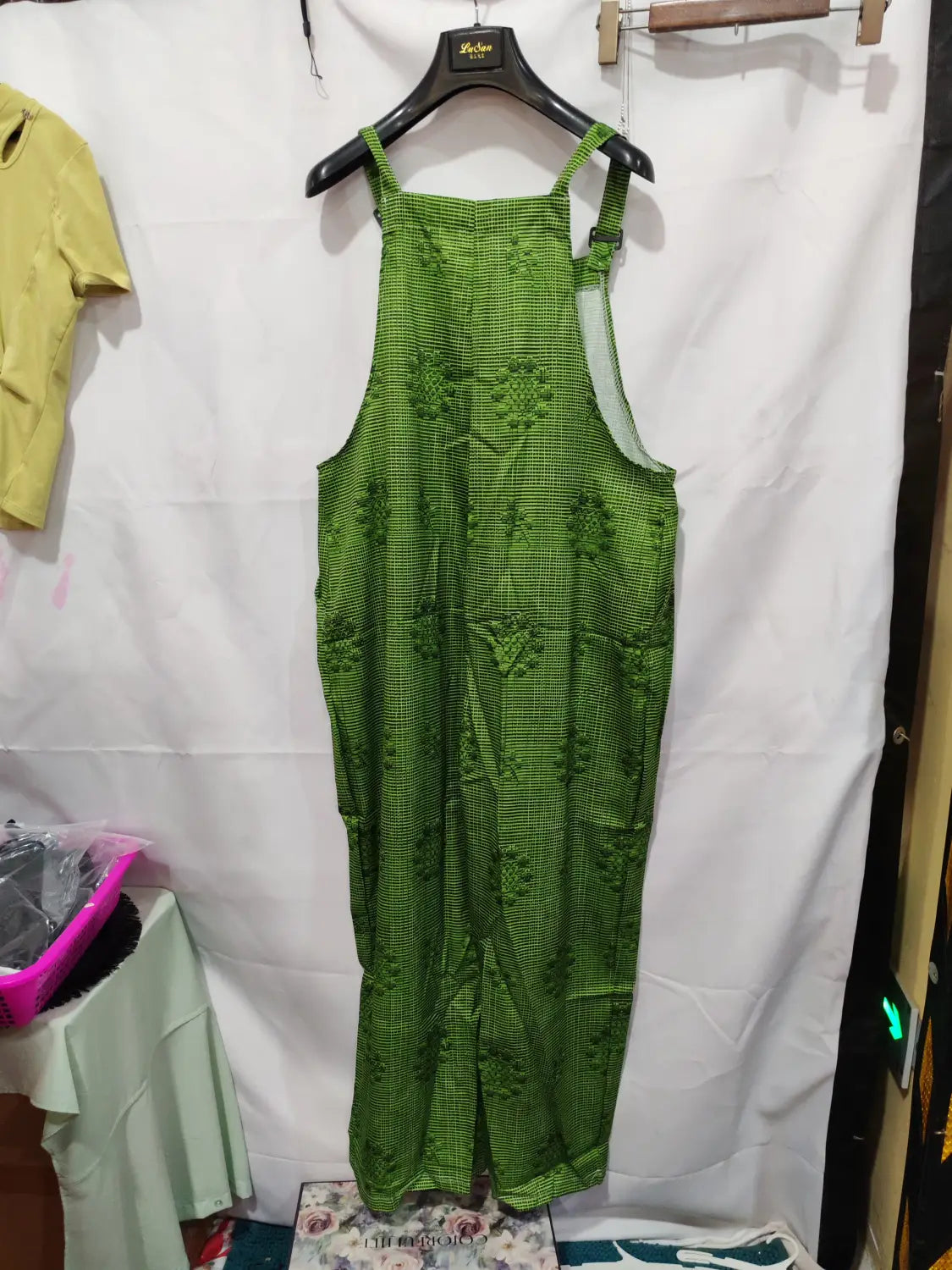 Green patterned suspender pants featuring a checkered design and embroidered floral motifs in casual 3d printed button trousers.