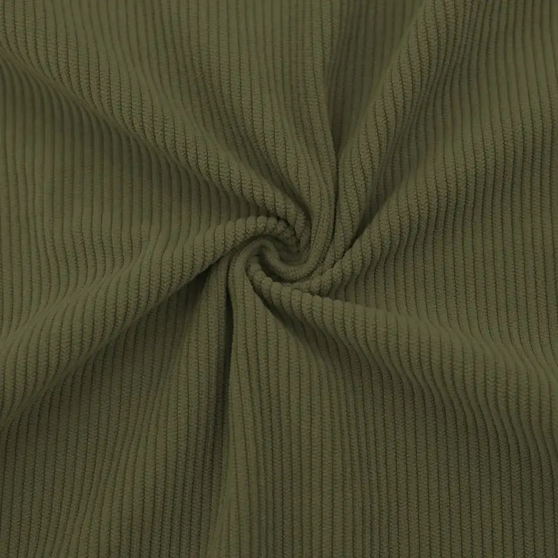 Slim fit corduroy patchwork pullover in olive green featuring soft ribbed fabric with contrast accents.
