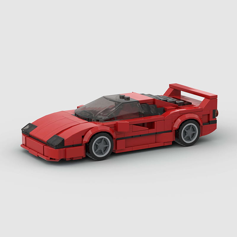 Modelo de coche deportivo de juguete de bloques tipo construcción, Ferrari F40 Lego rojo, con acentos negros y ruedas grises.