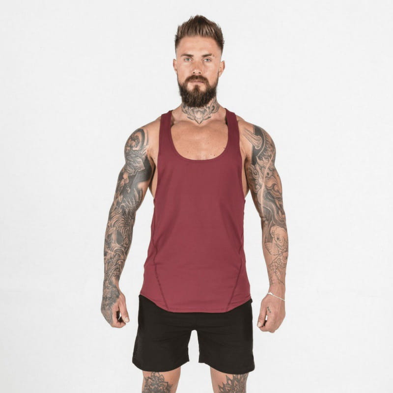 Men’s go hard racerback athletic tank top in maroon sleeveless design with a scoop neckline and side seam detailing for activewear use.