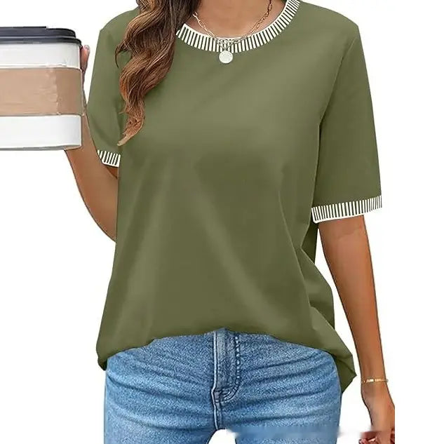 woman wearing an olive green short-sleeved knit top with white striped trim at the neckline and cuffs featuring ruffle detailing