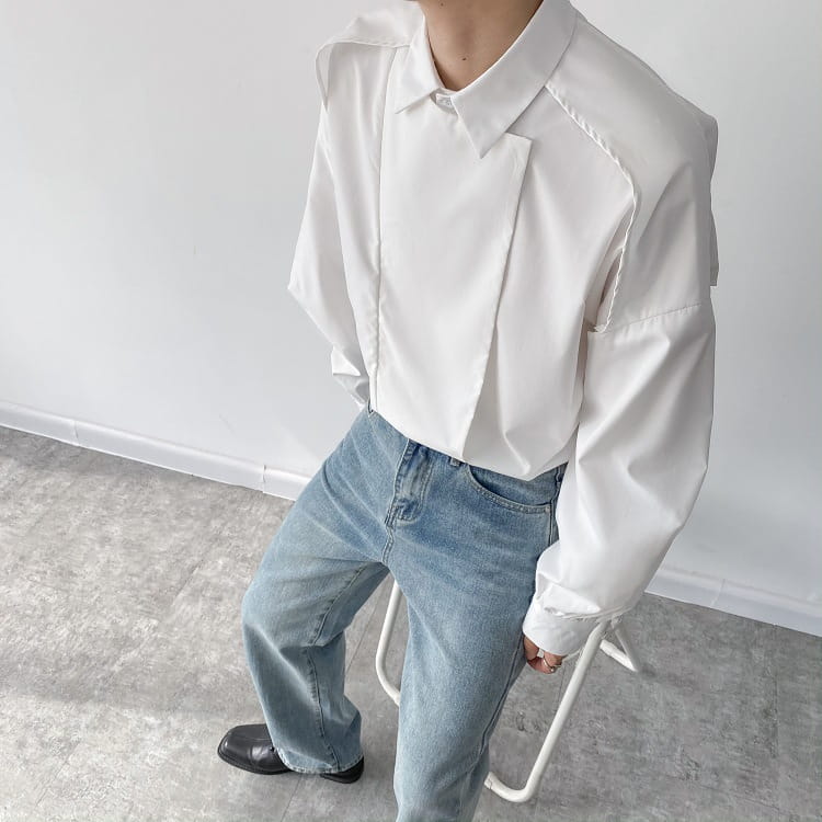White men oversized long sleeve button up shirt featuring a modern design with stitched paneling and a slightly oversized fit.