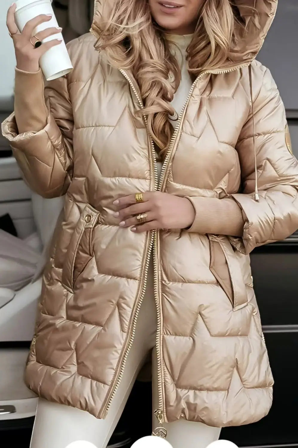 A shiny metallic gold quilted hooded down puffer jacket with a front zipper and glossy finish.