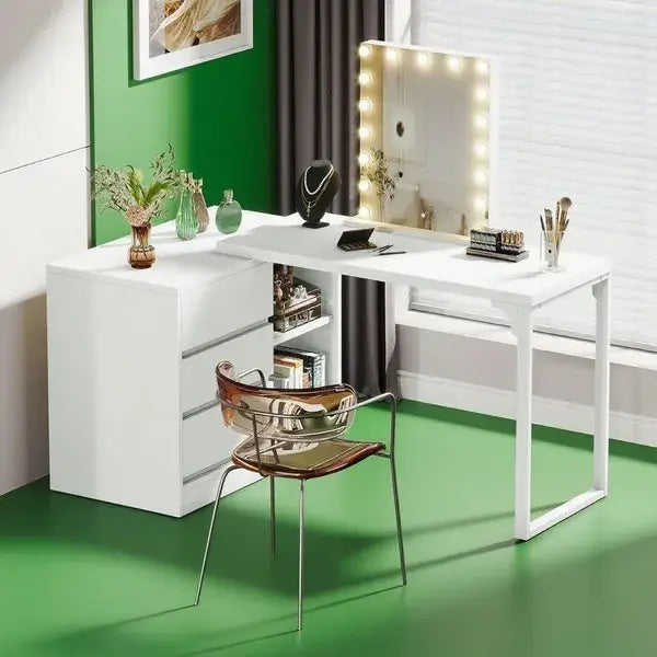 White modern L-shaped makeup vanity in wood finish with integrated drawers open shelving and built-in illuminated mirror frame.