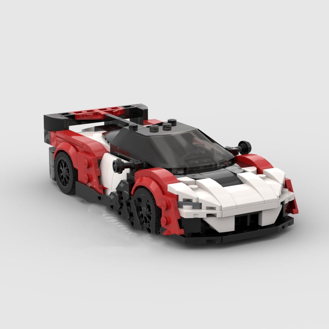 Modelo de coche de carreras de Lego rojo, blanco y negro, con un diseño aerodinámico y elegante para el juguete de coche deportivo de bloques de construcción Orange McLaren Speedtail.