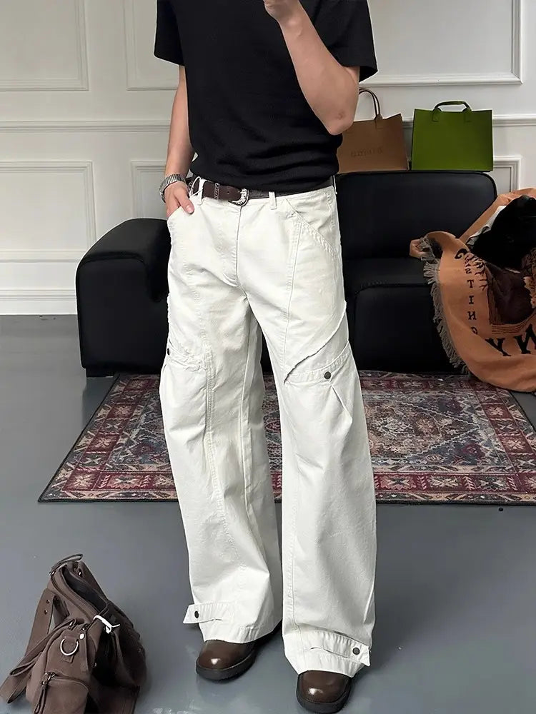 white wide-leg cargo pants in off-white featuring multiple pockets and buttoned cuffs for functional style.