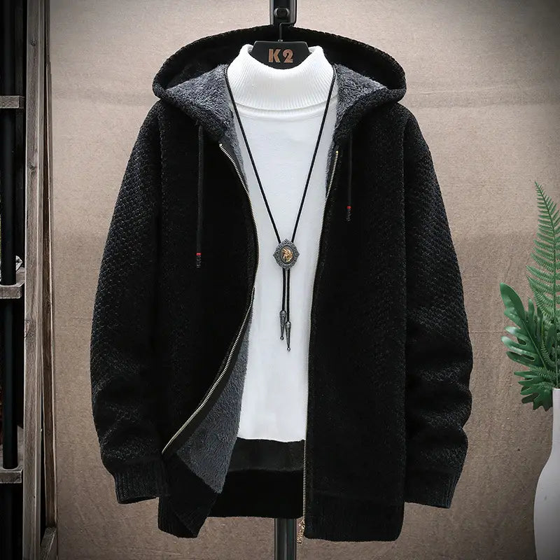 Pull à capuche zippé doublé de polaire pour homme en polaire noire texturée, avec un intérieur doublé de sherpa gris et des cordons de serrage.
