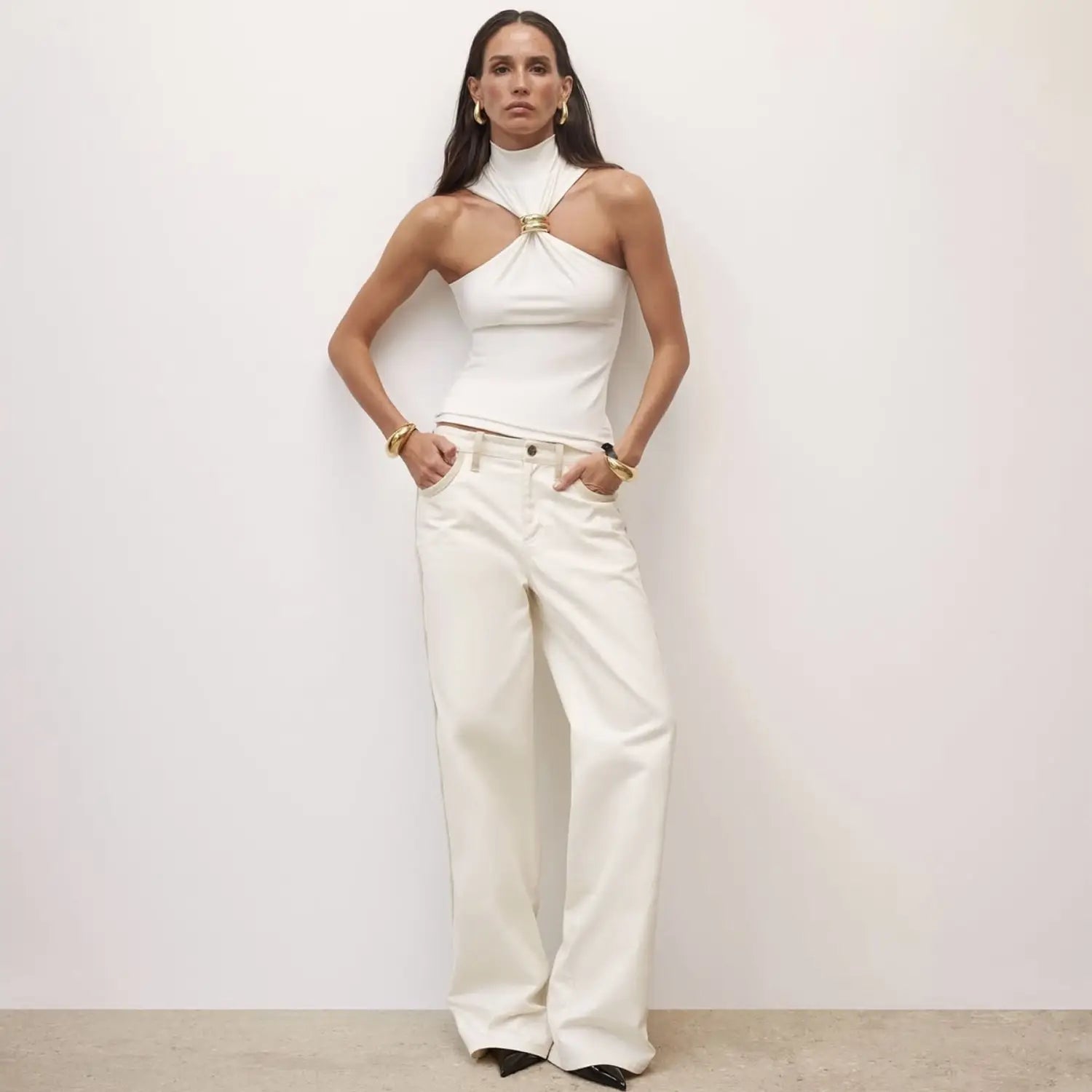 White high-neck halter stretch top featuring a gold-toned ring clasp detail.