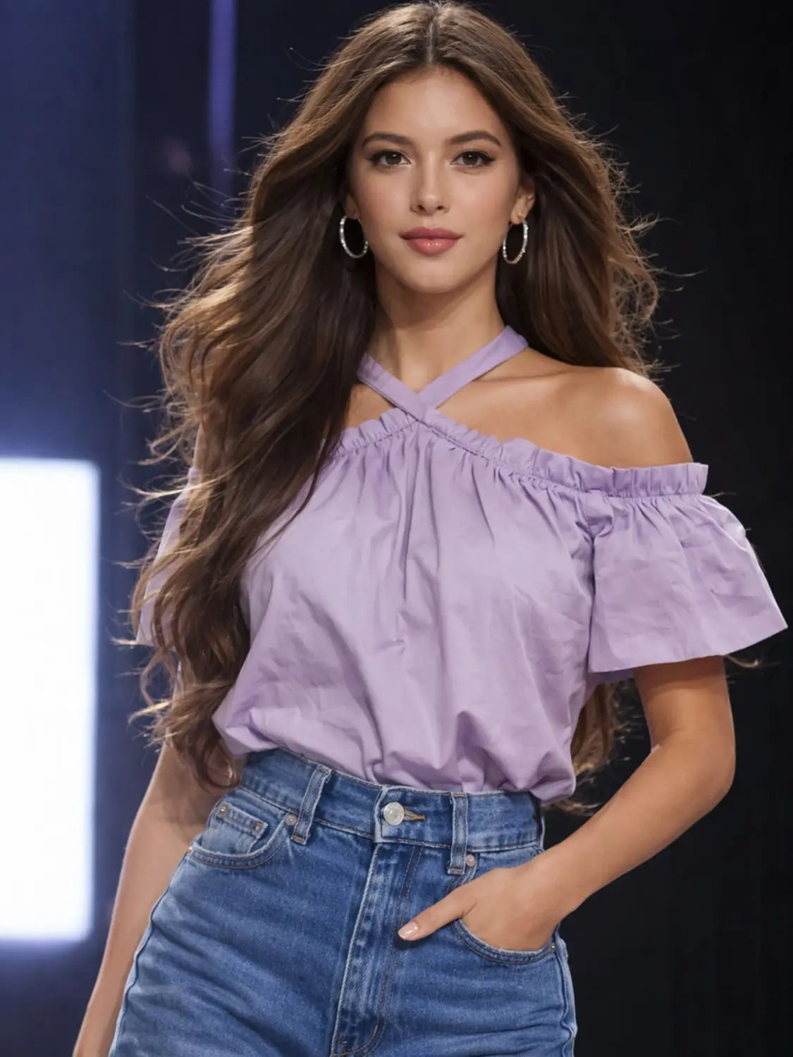 Lavender off-the-shoulder blouse with ruffled sleeves and a cross-back neckline shown from the back.