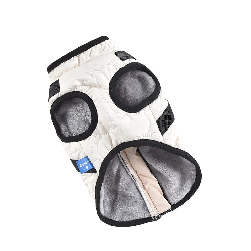 White quilted dog vest with black trim and gray fleece lining designed as a windproof warm pet coat.