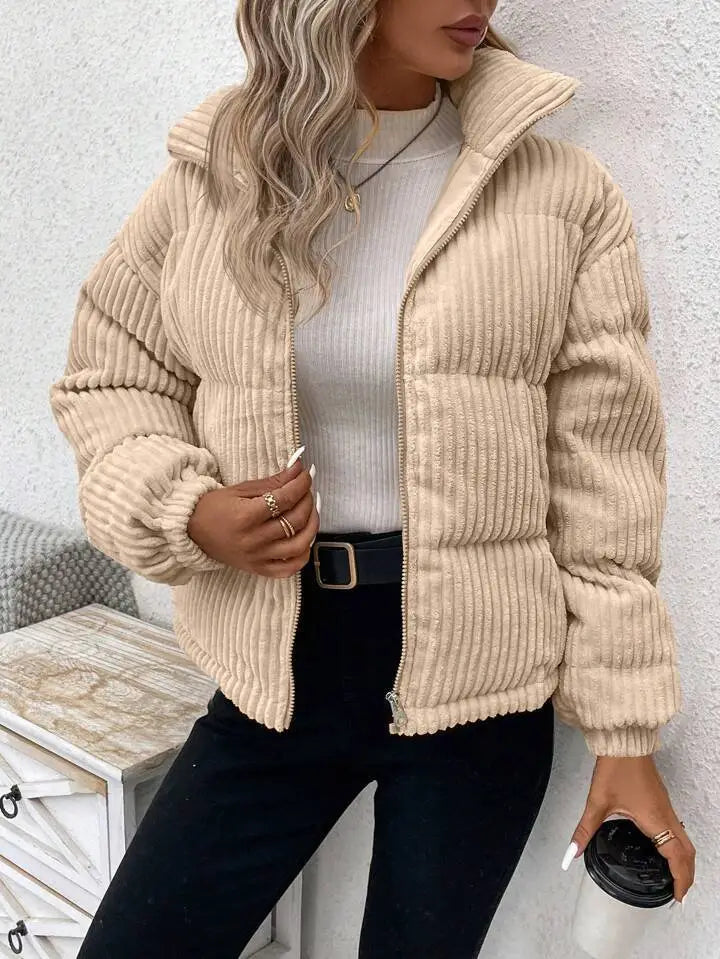 Beige corduroy puffer jacket with a quilted design and ribbed cuffs for plus size women winter coat.