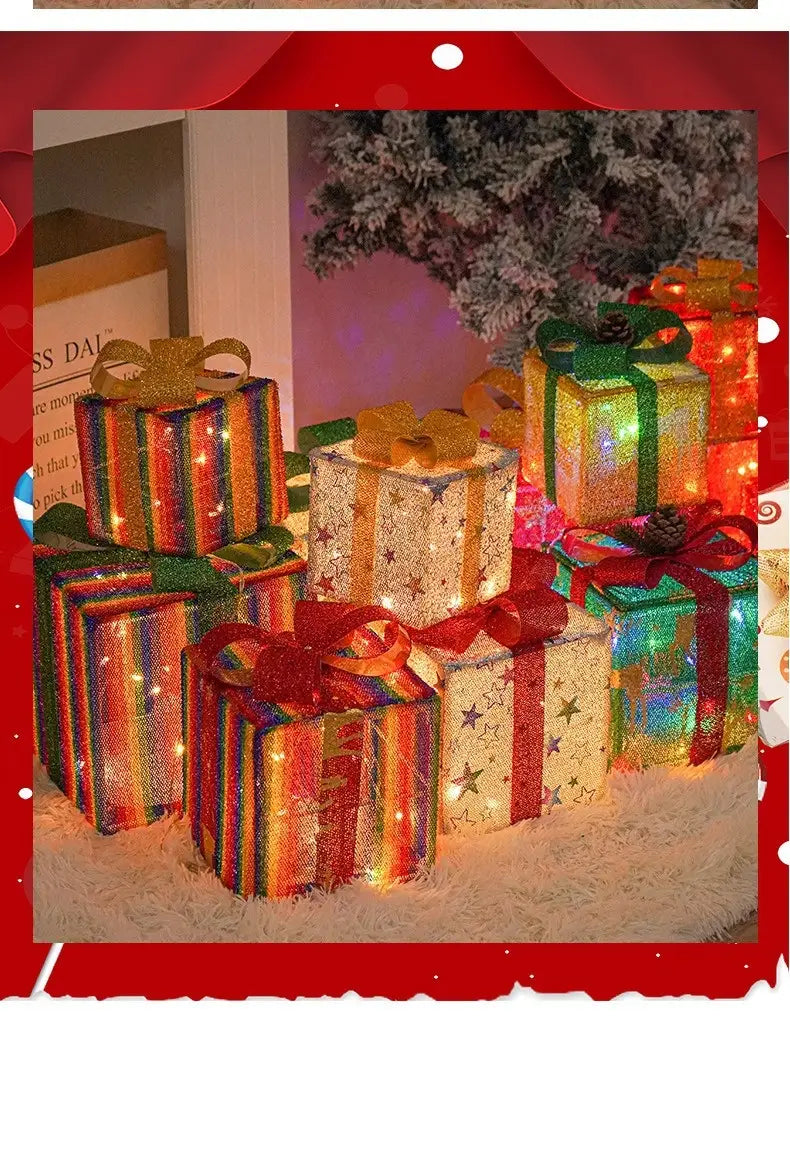 led christmas gift box set featuring colorful illuminated boxes with glittery ribbons and bows for festive decoration.