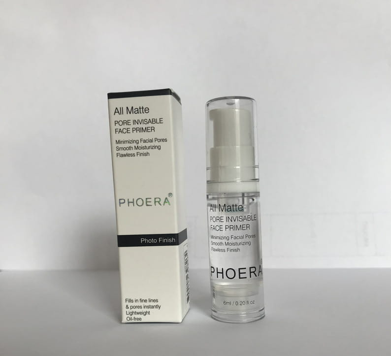 Clear glass bottle with white pump dispenser containing transparent liquid labeled phoera all matte pore invisible face primer in a 6ml packaging for facial use.