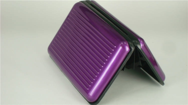 Purple ribbed rfid blocking aluminum alloy card holder case with black edges.