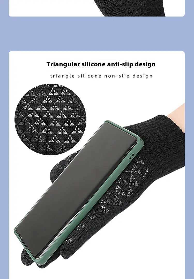 Black knitted usb heated typing glove with triangular silicone anti-slip design on the palm holding a green phone case for thermal winter use.