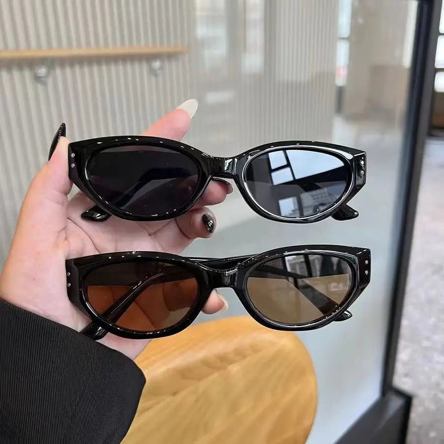 Black cat eye uv400 sunglasses with glossy modern frames and dark lenses one pair featuring mirrored surfaces.