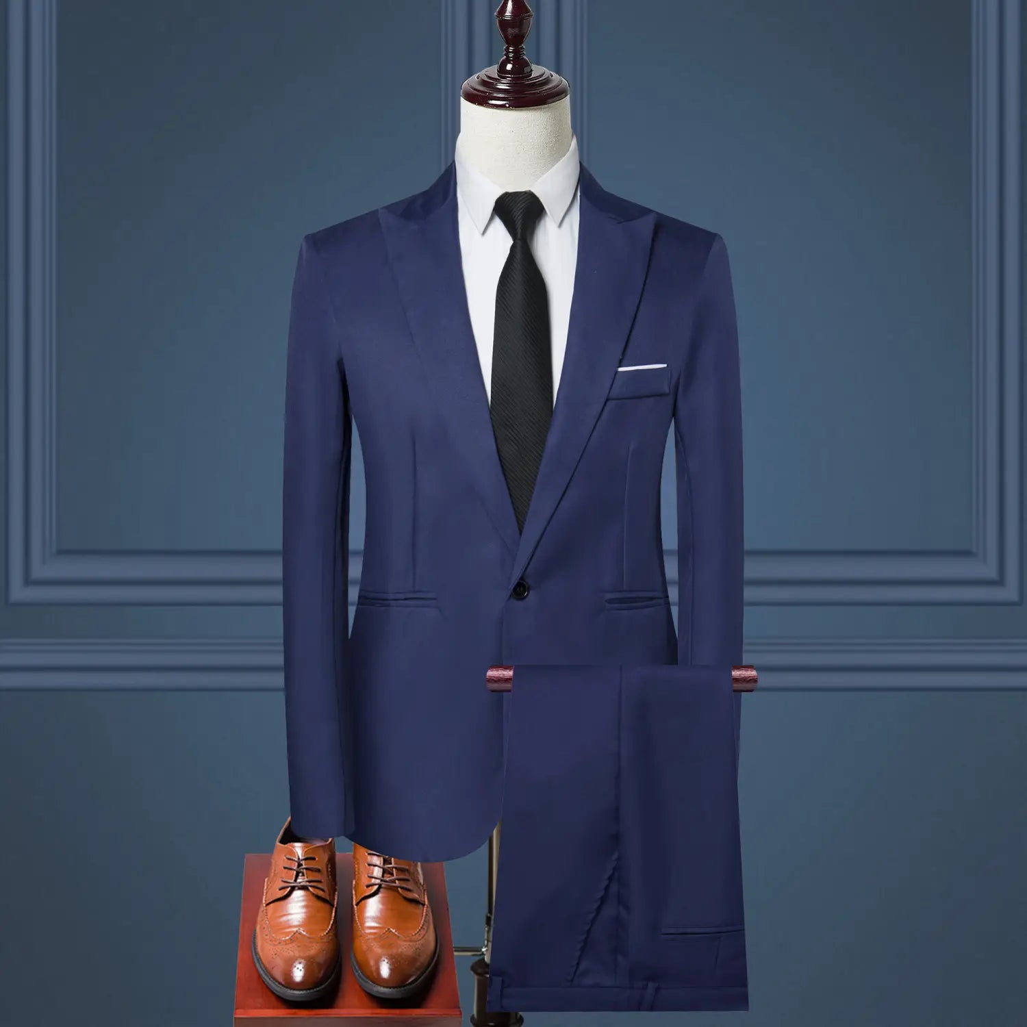Navy blue solid color two piece leisure suit with tailored jacket matching trousers and black tie displayed on a mannequin.