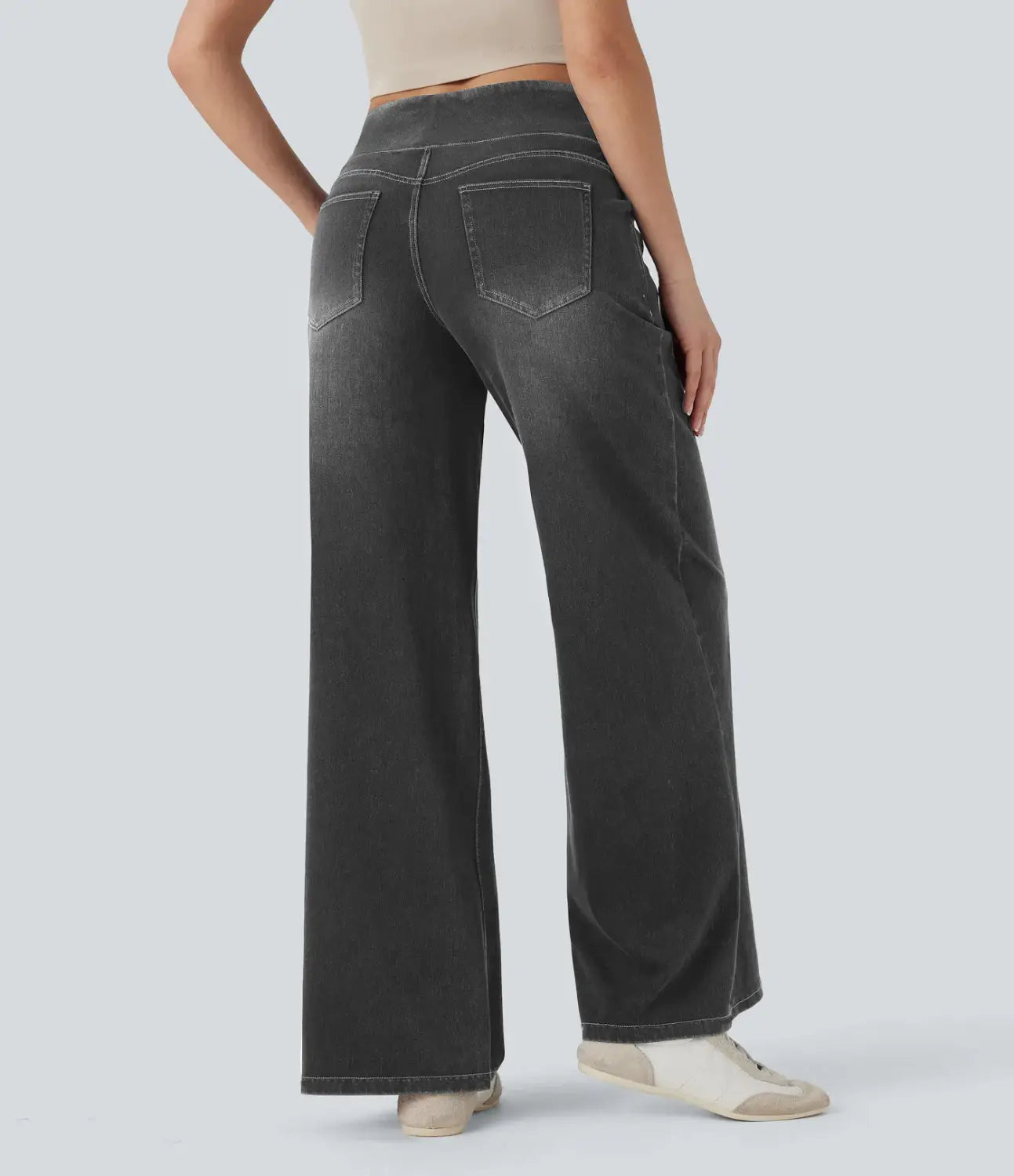 dark gray wide leg stretchy high waisted denim jeans shown from the back with classic back pockets