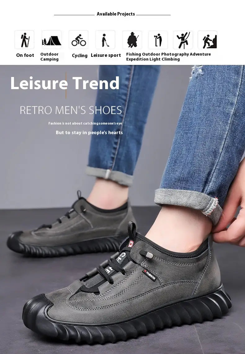Dark gray suede men’s retro hiking shoes with black chunky rubber soles and laces designed as casual sneakers.