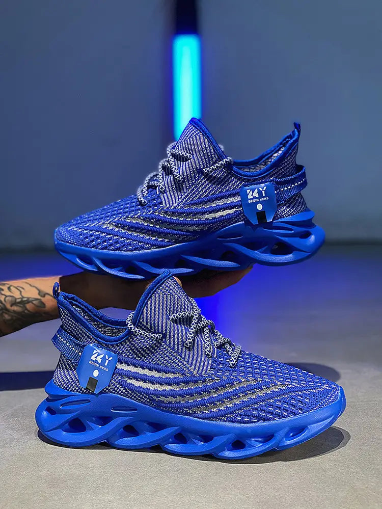 Vibrant blue flyknit mesh platform running shoes for men featuring a bold sculpted rubber sole and matching laces.