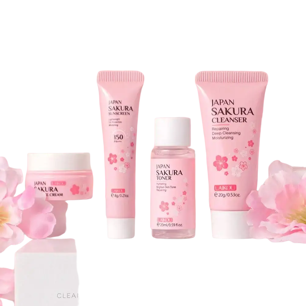 Pink japan sakura travel kit with face cream cleanser toner and sunscreen in cherry blossom design tubes for women