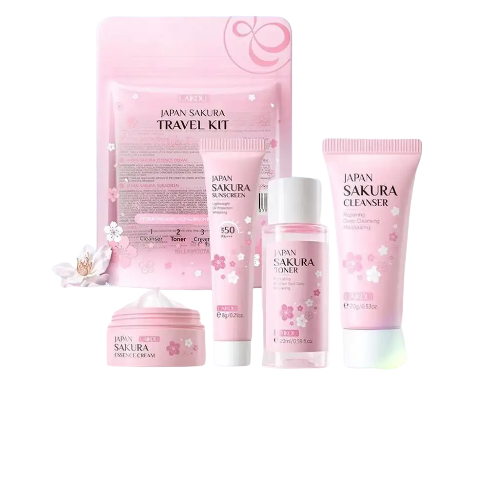 Pink Japan sakura travel kit with face cream and multiple skincare products featuring cherry blossom design