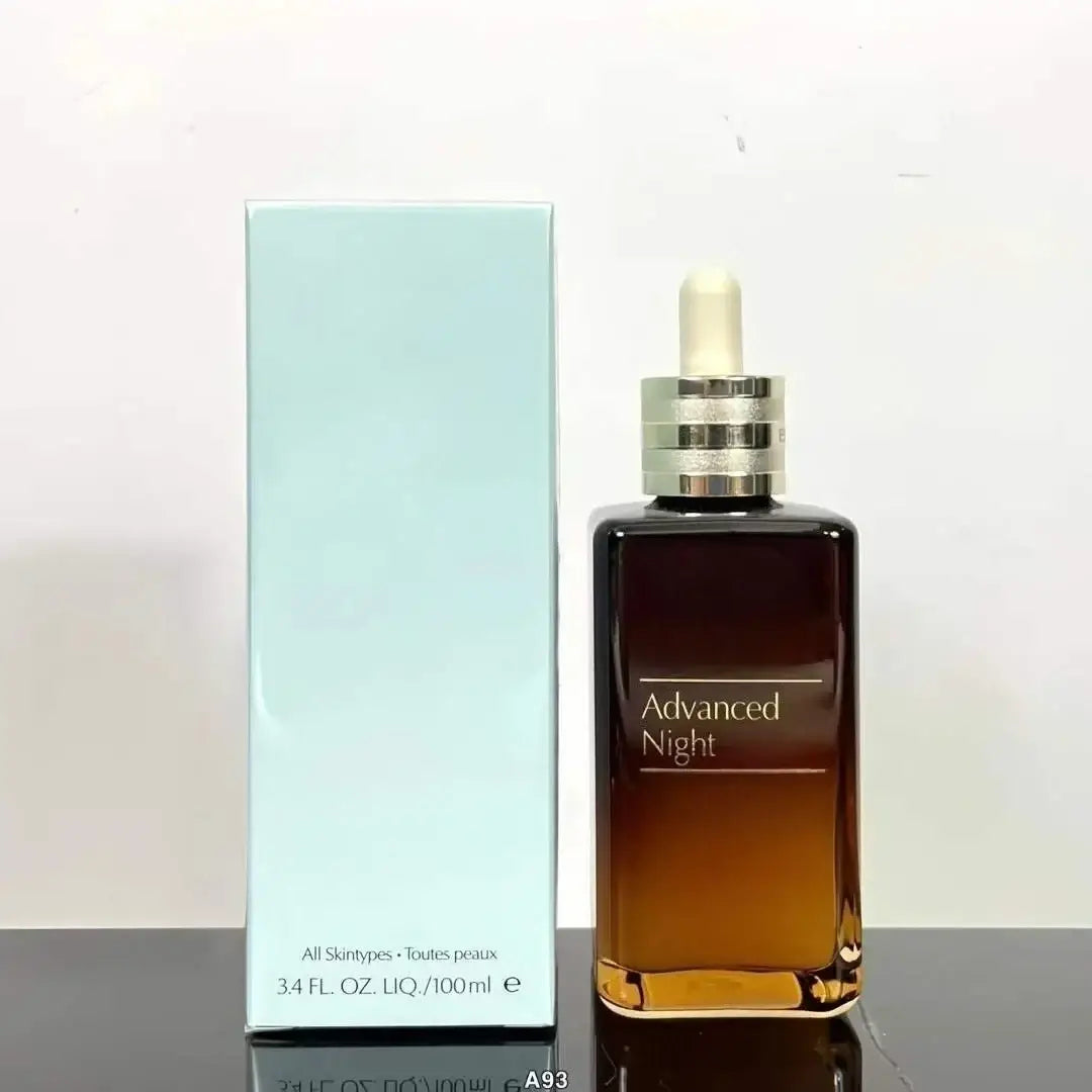 A sleek rectangular glass bottle of estée lauder advanced night repair face serum 100ml with amber liquid and silver dropper cap