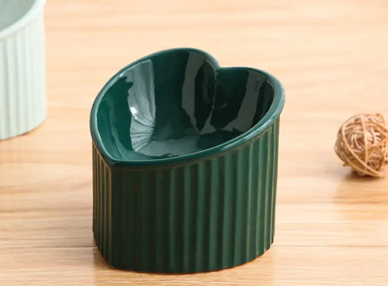 Dark green ceramic tilted cat bowl with a heart-shaped design and vertical ridges from a 4 pack set.