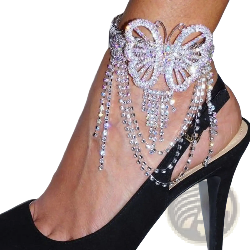 A sparkling silver fairy butterfly rhinestone tassel anklet adorned with cascading rhinestone chains