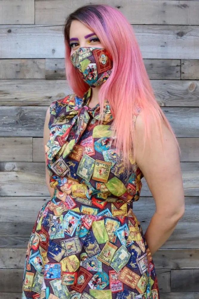 A vibrant sleeveless fairytale books vintage bow top in 2x featuring a colorful collage of vintage product labels