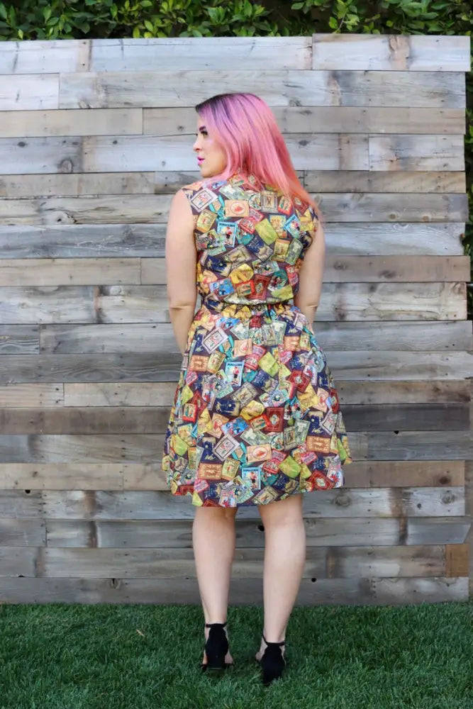 A vibrant sleeveless a-line dress with a colorful vintage tea bag collage print in size 2x from fairytale books