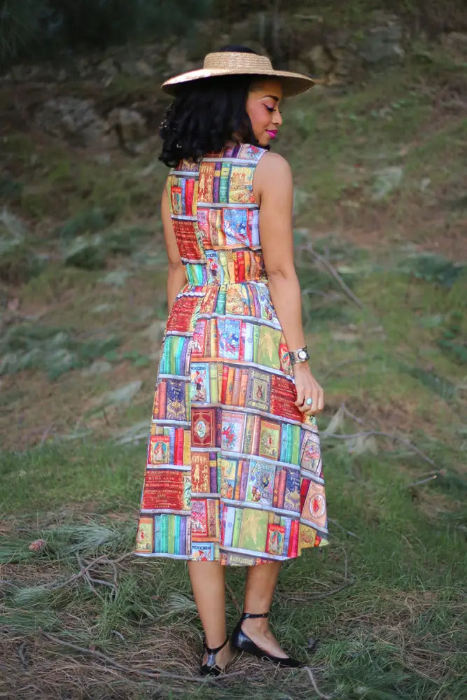 Fairytales bibliophile sleeveless cotton midi dress with vibrant patchwork of colorful book spine prints
